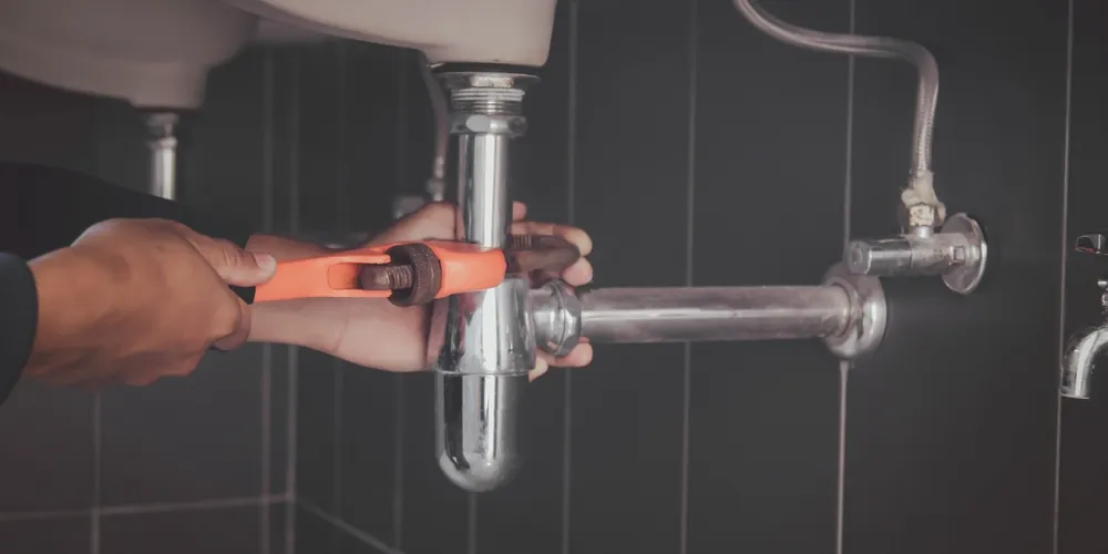 Rockwood Plumbing LLC expert fixing pipes in Fort Wayne, Indiana, offering plumbing solutions and consultations.